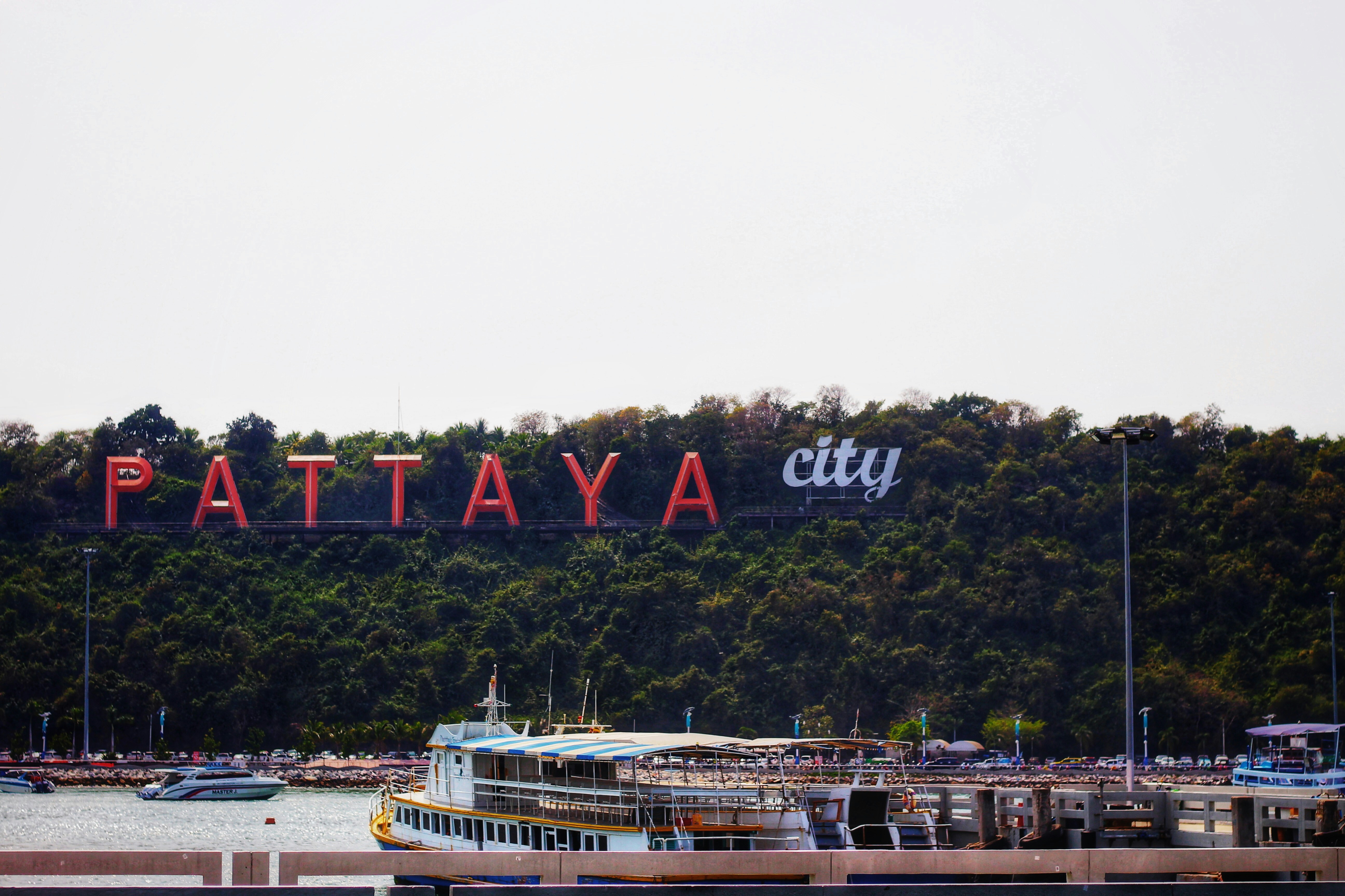 Pattaya City sign above the hillside and waterfront